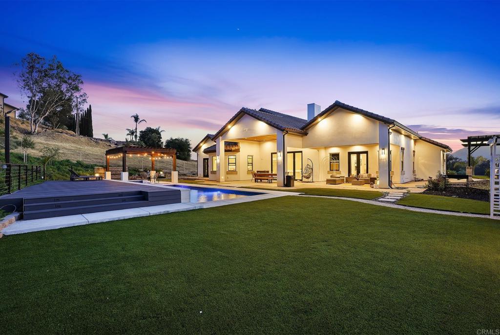 14989 Orchard View Drive Poway, CA 92064 - Photo 43 of 50 a view of a big house with a big yard