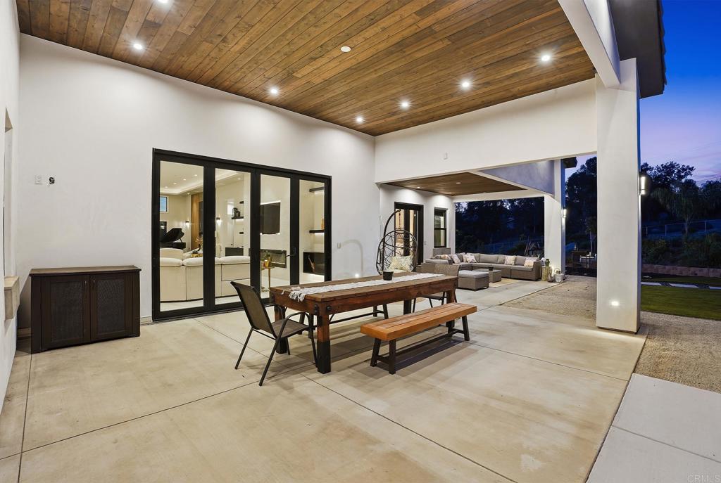 14989 Orchard View Drive Poway, CA 92064 - Photo 7 of 50 a living room with furniture a flat screen tv and a large window