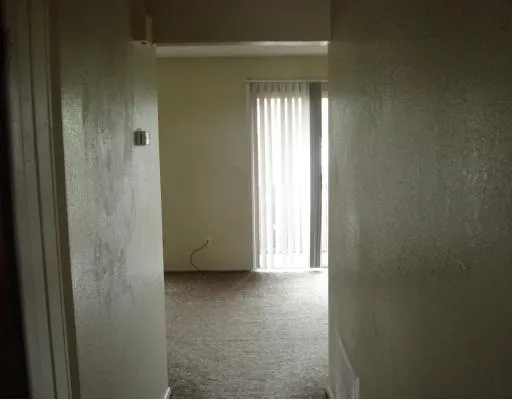 a view of an empty room and window
