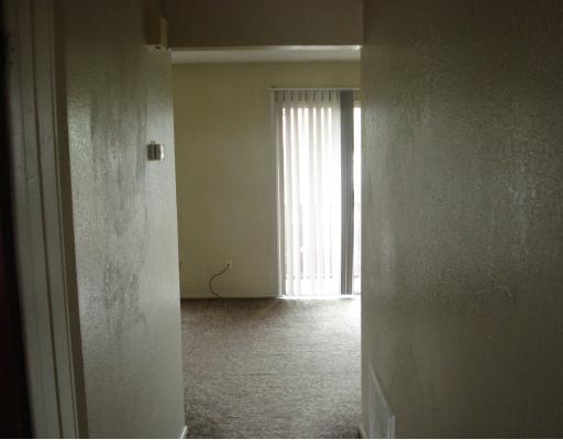 857 Quetzal Street, Unit 3 Corpus Christi, TX 78418 - Photo 9 of 10 a view of an empty room and window