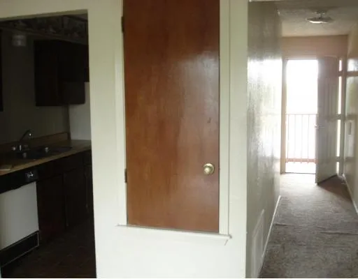 a view of a bathroom from a hallway