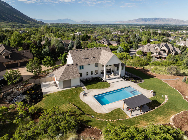 4292 Silver Sage Circle Alpine, UT 84004 - Photo 41 of 41 Expansive property featuring a white exterior, a large swimming pool, a concrete pool deck, and a detached pergola structure