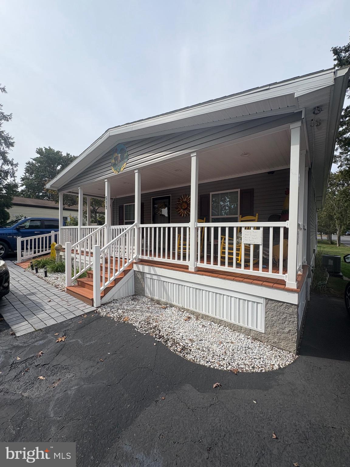 a view of a house with a wooden deck