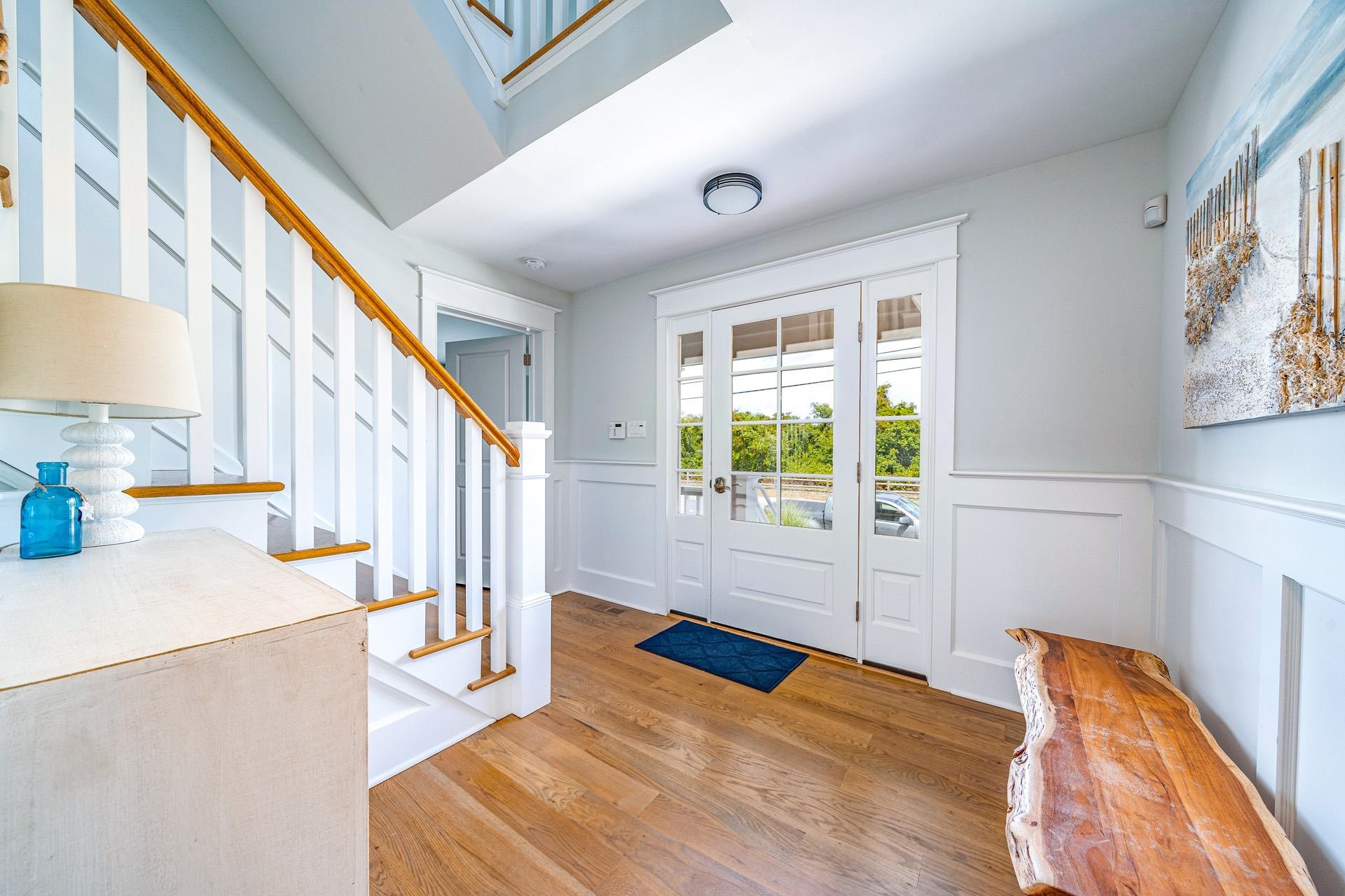 7418 Dune Drive Avalon, NJ 08202 - Photo 12 of 50 a view of an empty room with wooden floor and windows