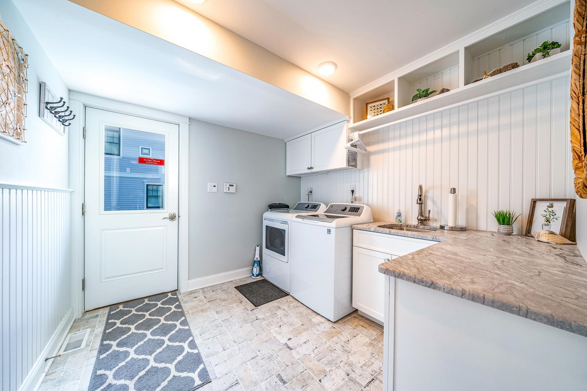 7418 Dune Drive Avalon, NJ 08202 - Photo 14 of 50 a room with a washer and dryer