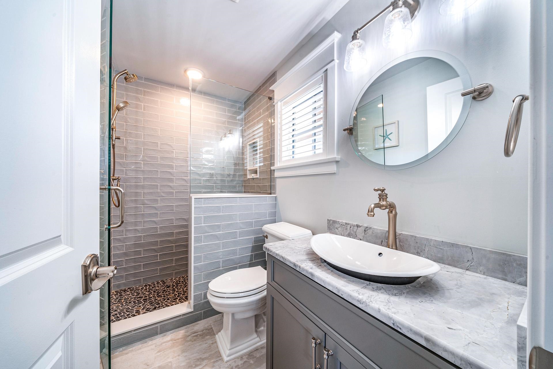 7418 Dune Drive Avalon, NJ 08202 - Photo 21 of 50 a bathroom with a granite countertop sink mirror and toilet