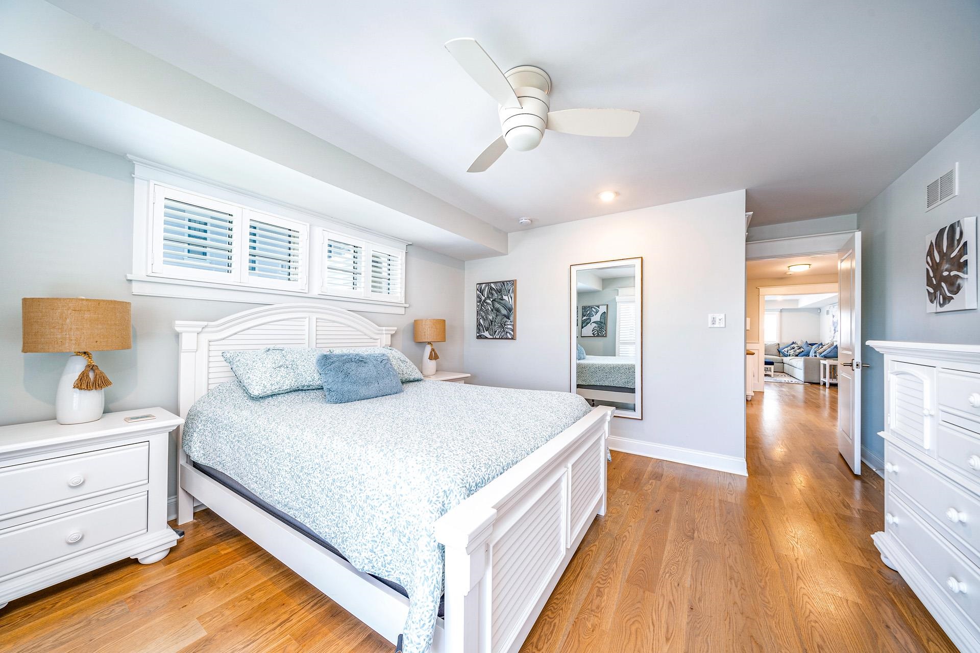 7418 Dune Drive Avalon, NJ 08202 - Photo 22 of 50 a bedroom with a bed and wooden floor