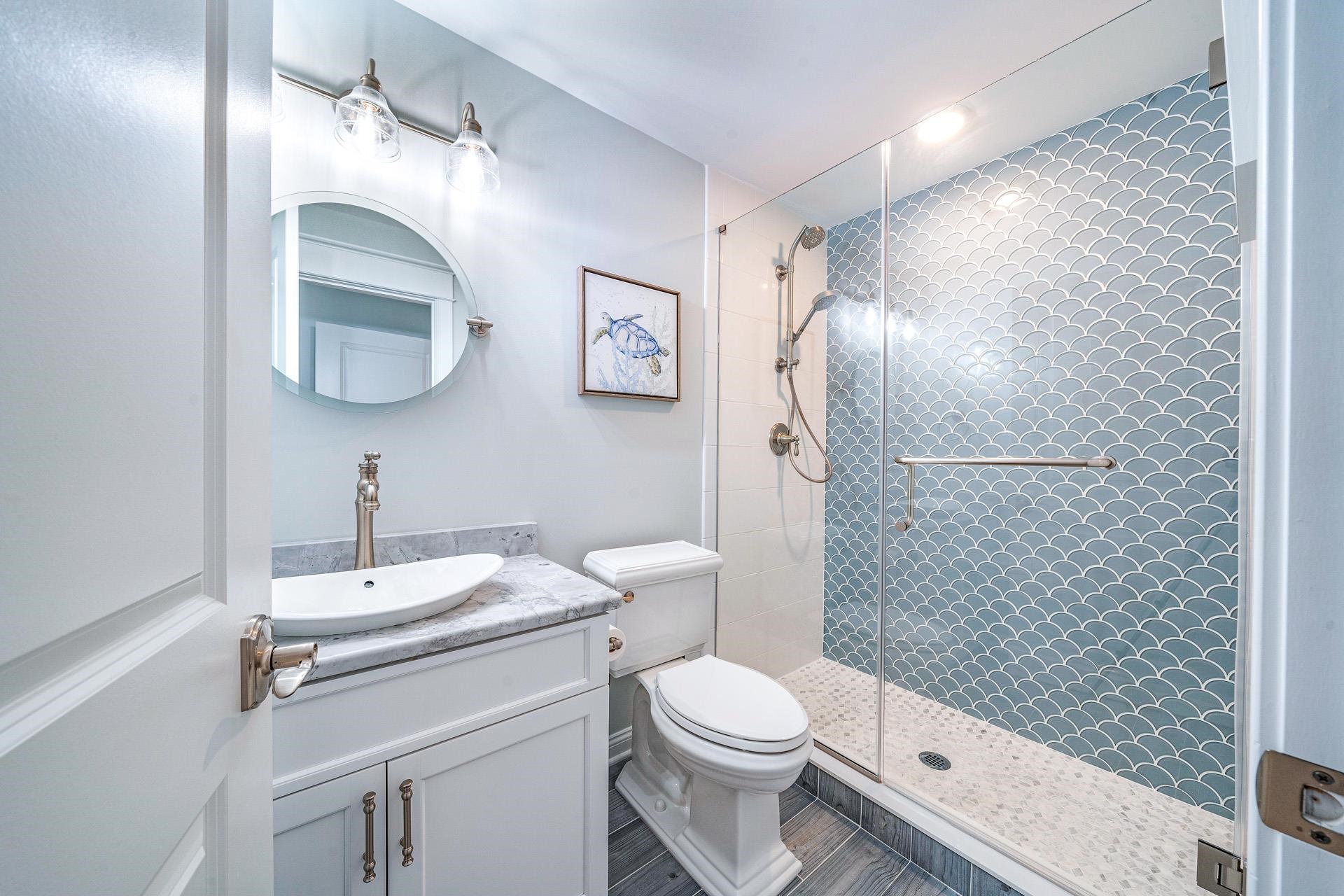 7418 Dune Drive Avalon, NJ 08202 - Photo 23 of 50 a bathroom with a toilet sink and shower