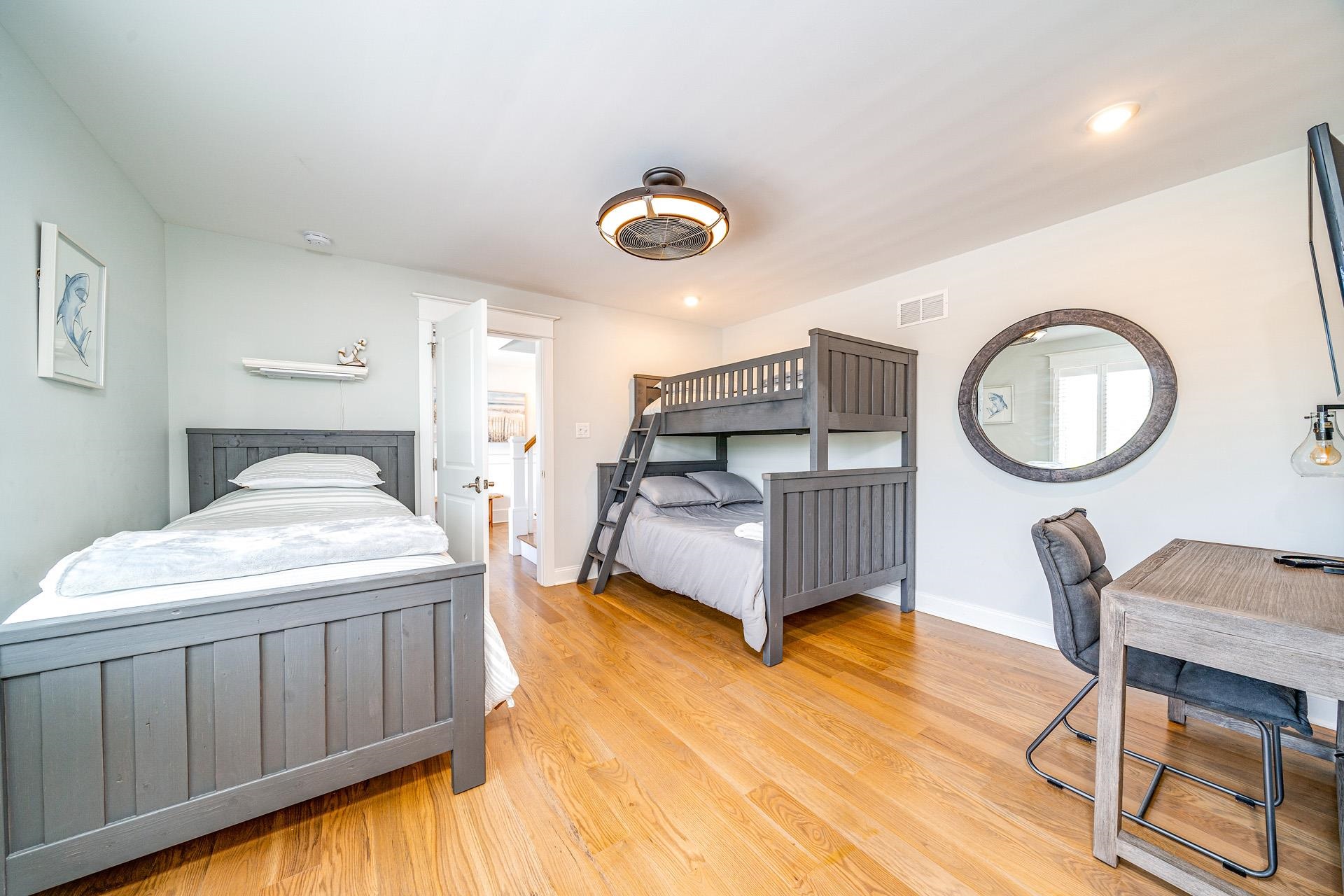 7418 Dune Drive Avalon, NJ 08202 - Photo 24 of 50 a bedroom with a bed a dresser and chair