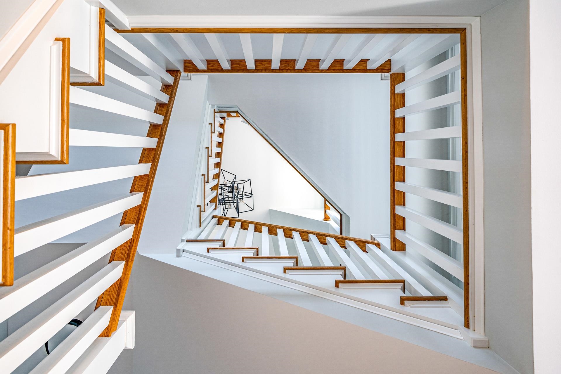 7418 Dune Drive Avalon, NJ 08202 - Photo 26 of 50 a view of staircase with railing and white walls