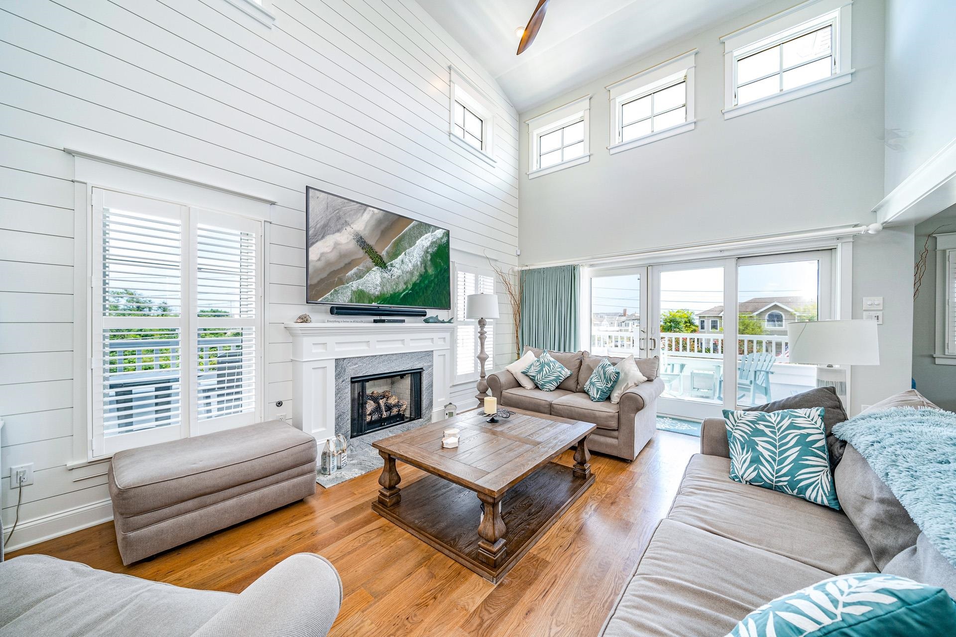 7418 Dune Drive Avalon, NJ 08202 - Photo 27 of 50 a living room with fireplace furniture and a flat screen tv