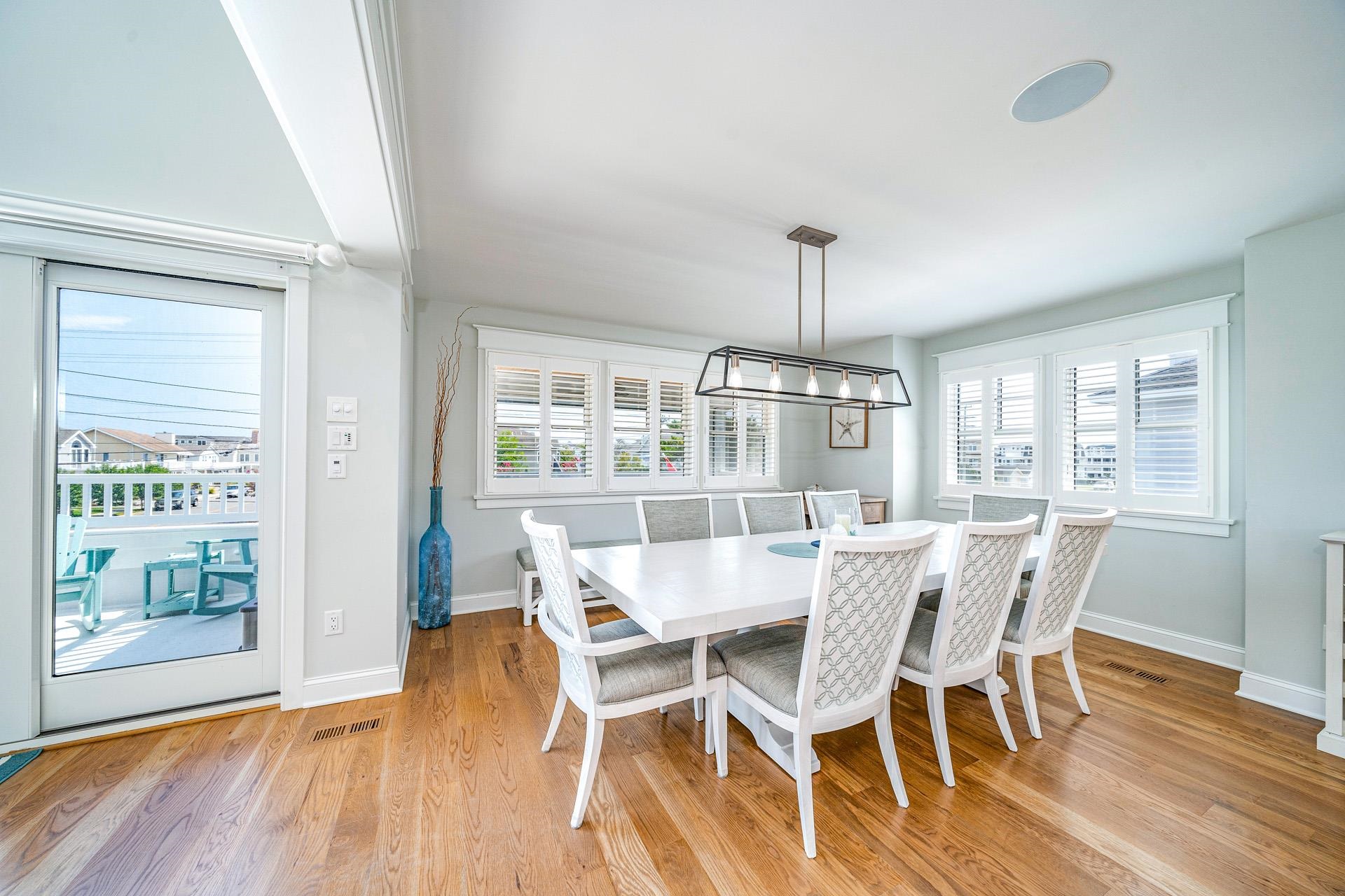 7418 Dune Drive Avalon, NJ 08202 - Photo 31 of 50 a view of a dining room with furniture window and wooden floor