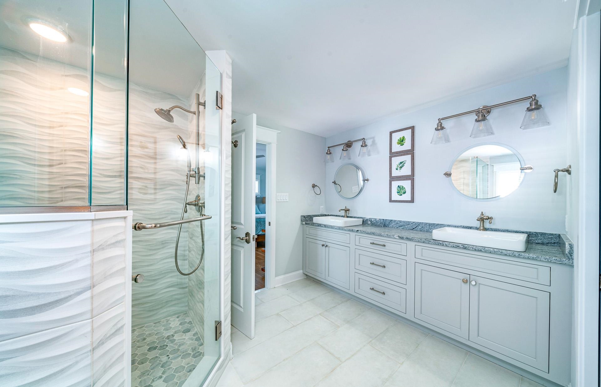 7418 Dune Drive Avalon, NJ 08202 - Photo 45 of 50 a spacious bathroom with a granite countertop sink mirror and a shower