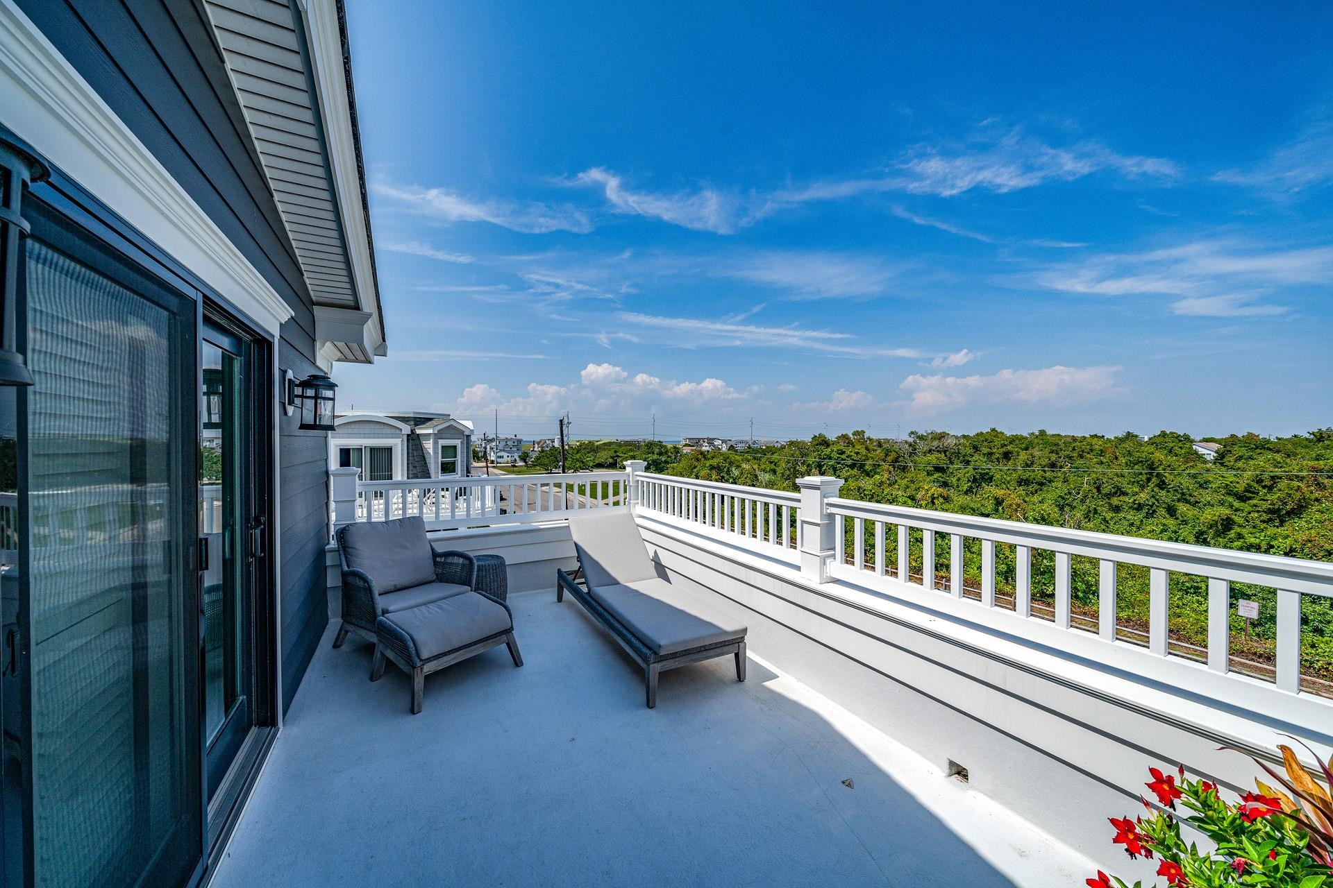 7418 Dune Drive Avalon, NJ 08202 - Photo 49 of 50 a view of a balcony with chairs