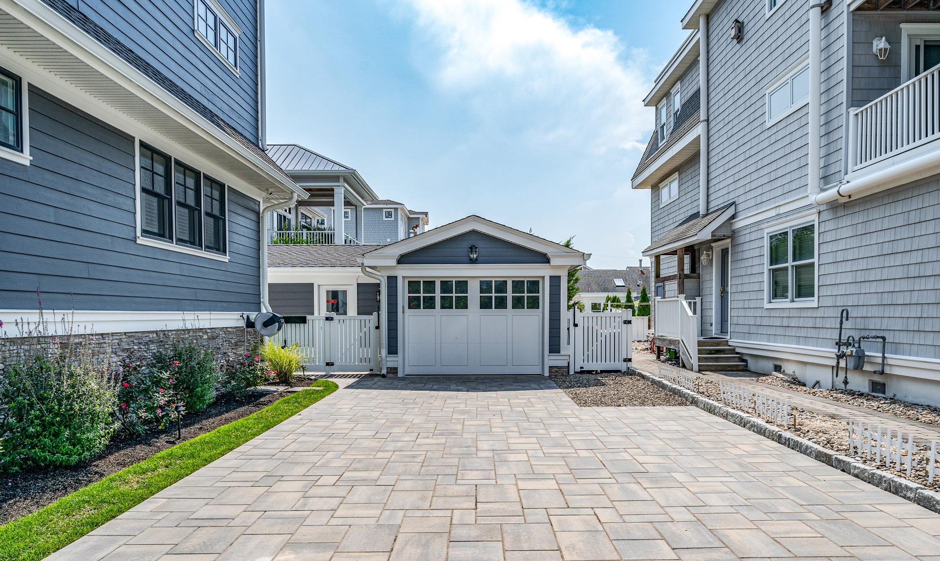 7418 Dune Drive Avalon, NJ 08202 - Photo 6 of 50 a front view of a house with a garden