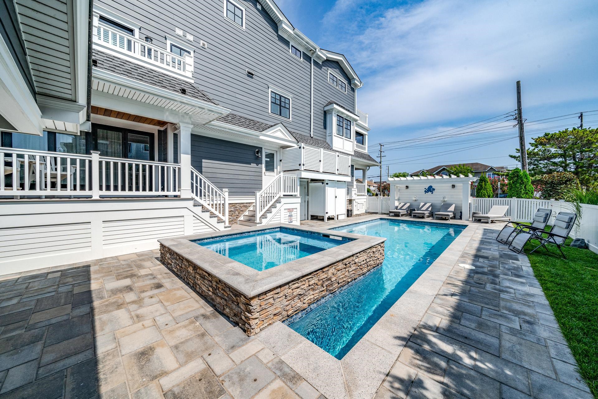 7418 Dune Drive Avalon, NJ 08202 - Photo 9 of 50 a view of a house with a yard and furniture