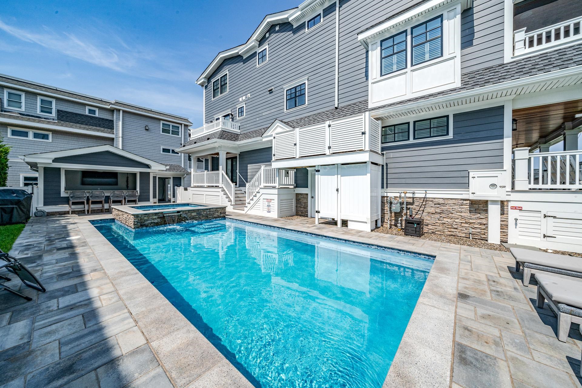 7418 Dune Drive Avalon, NJ 08202 - Photo 10 of 50 a swimming pool view with a outdoor seating