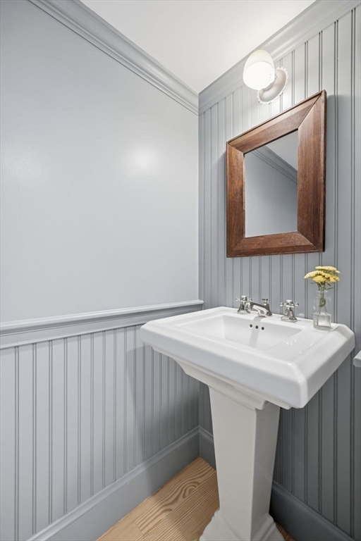 33 Franklin Street Marblehead, MA 01945 - Photo 19 of 42 a bathroom with a sink vanity and a mirror