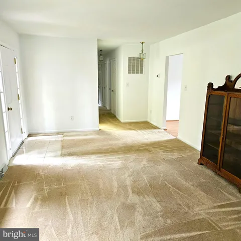 a view of a room with furniture and a rug