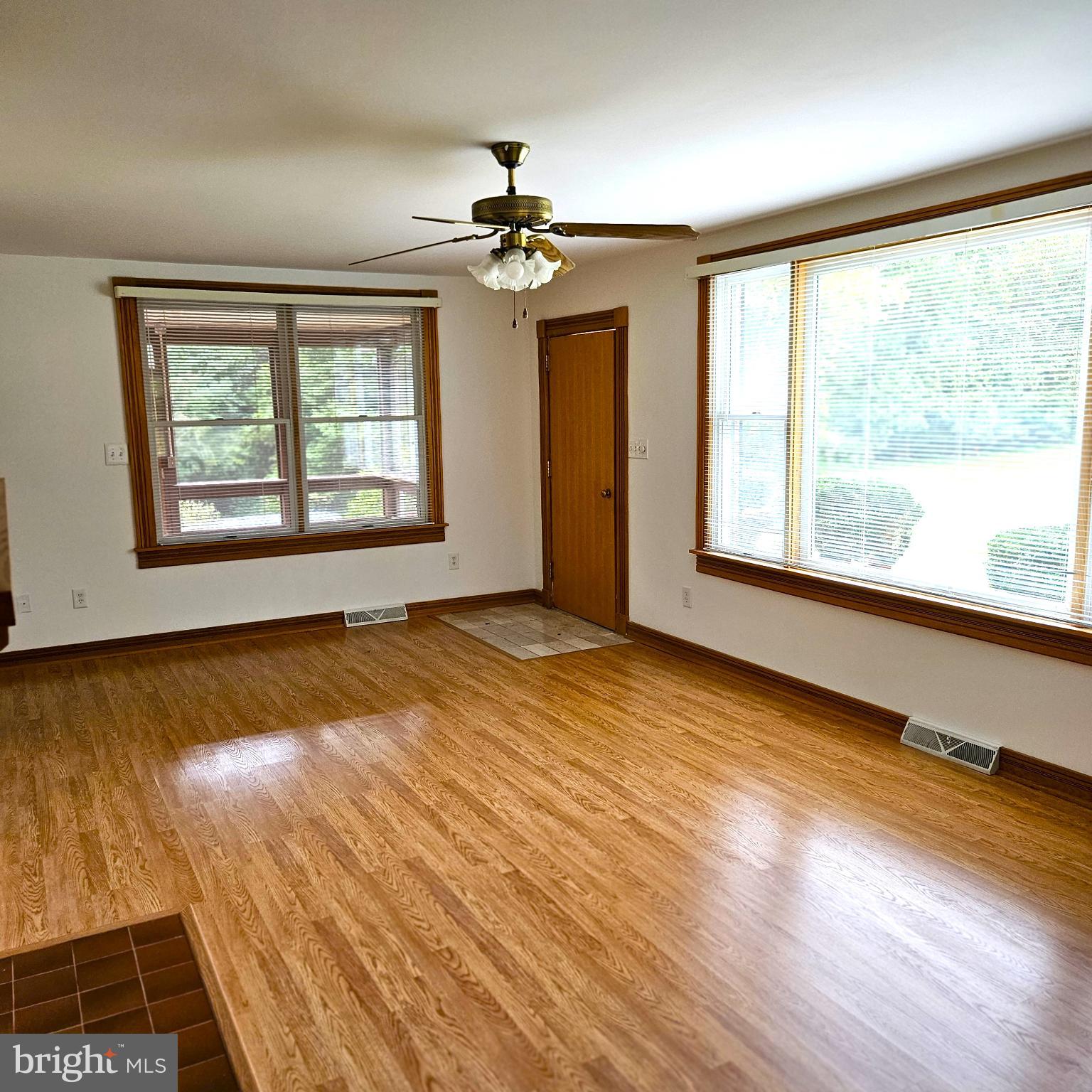 7 Skyline Lane Washington, VA 22747 - Photo 20 of 42 a view of an empty room with wooden floor and a window