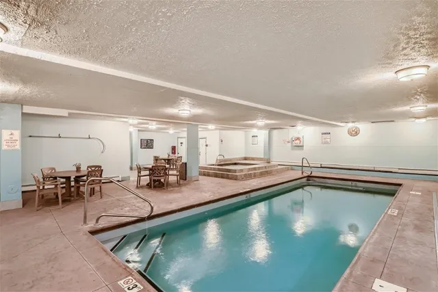 a view of a big room with closet and windows