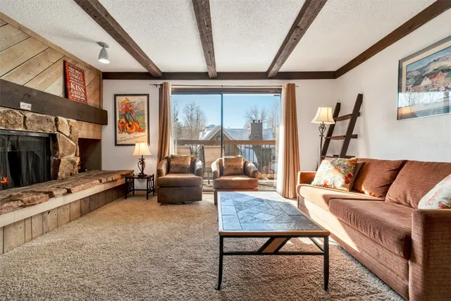 a living room with furniture and a rug