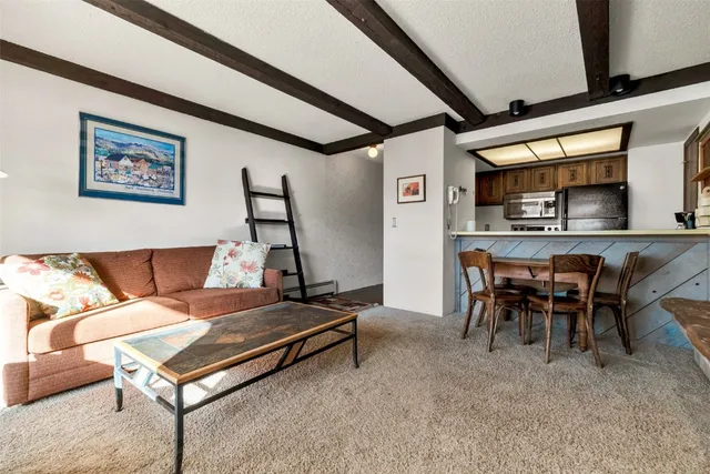 a dining room with a granite table and chairs
