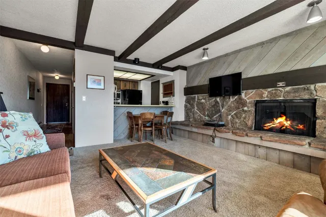 a kitchen with stainless steel appliances a stove a refrigerator and a sink