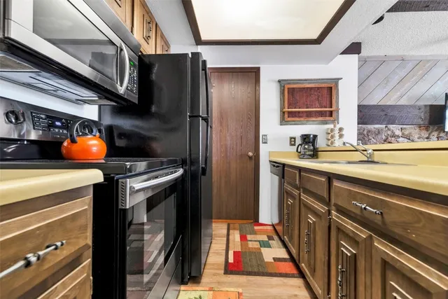 a kitchen with a sink and a microwave