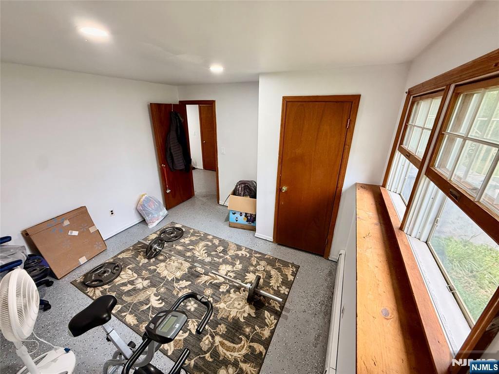 154 Cork Hill Road Franklin, NJ 07416 - Photo 24 of 35 a bedroom with a bed and wooden floor