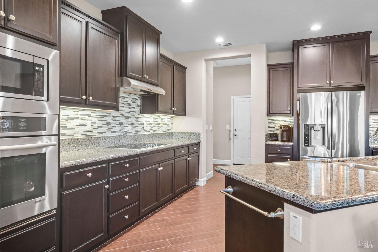 316 Birch Ridge Drive Rio Vista, CA 94571 - Photo 11 of 70 a kitchen with stainless steel appliances granite countertop a sink a stove and a refrigerator