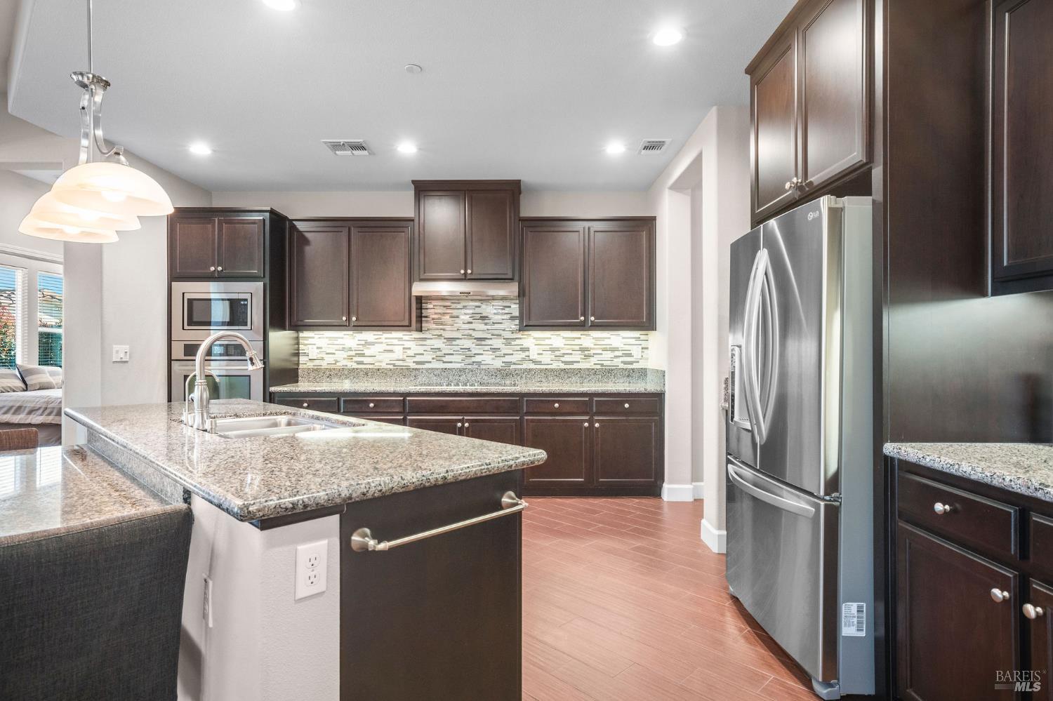 316 Birch Ridge Drive Rio Vista, CA 94571 - Photo 9 of 70 a kitchen with stainless steel appliances granite countertop a refrigerator and a sink