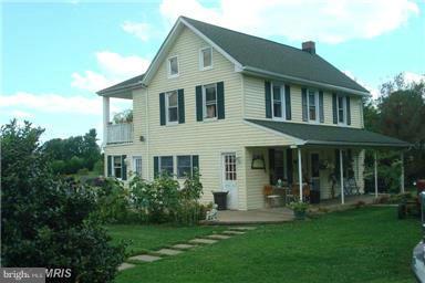 60 East Nicodemus Road Westminster, MD 21157 - Photo 2 of 21 a view of a white house with a big yard and potted plants