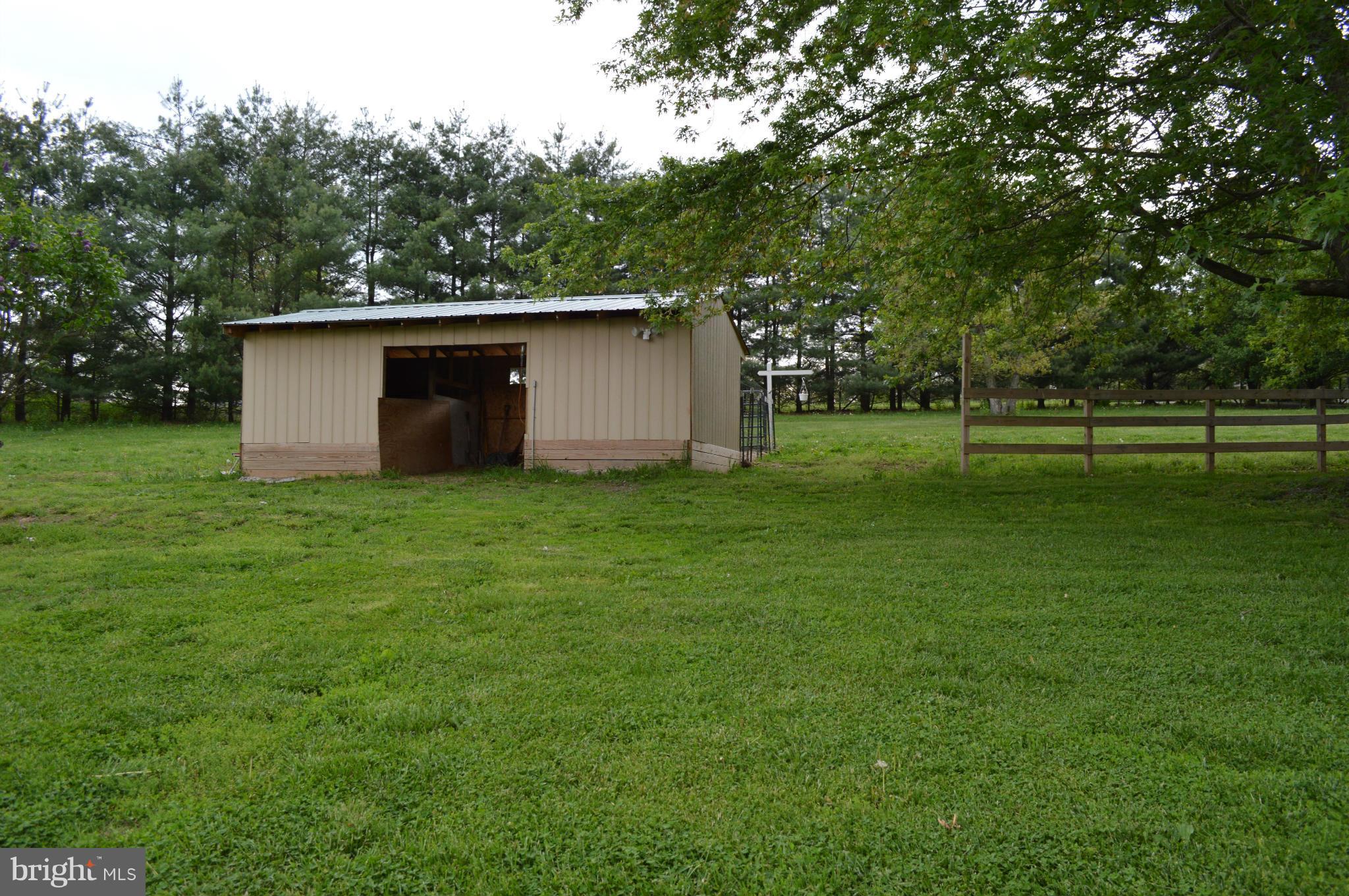 60 East Nicodemus Road Westminster, MD 21157 - Photo 13 of 21 a view of a backyard with large trees