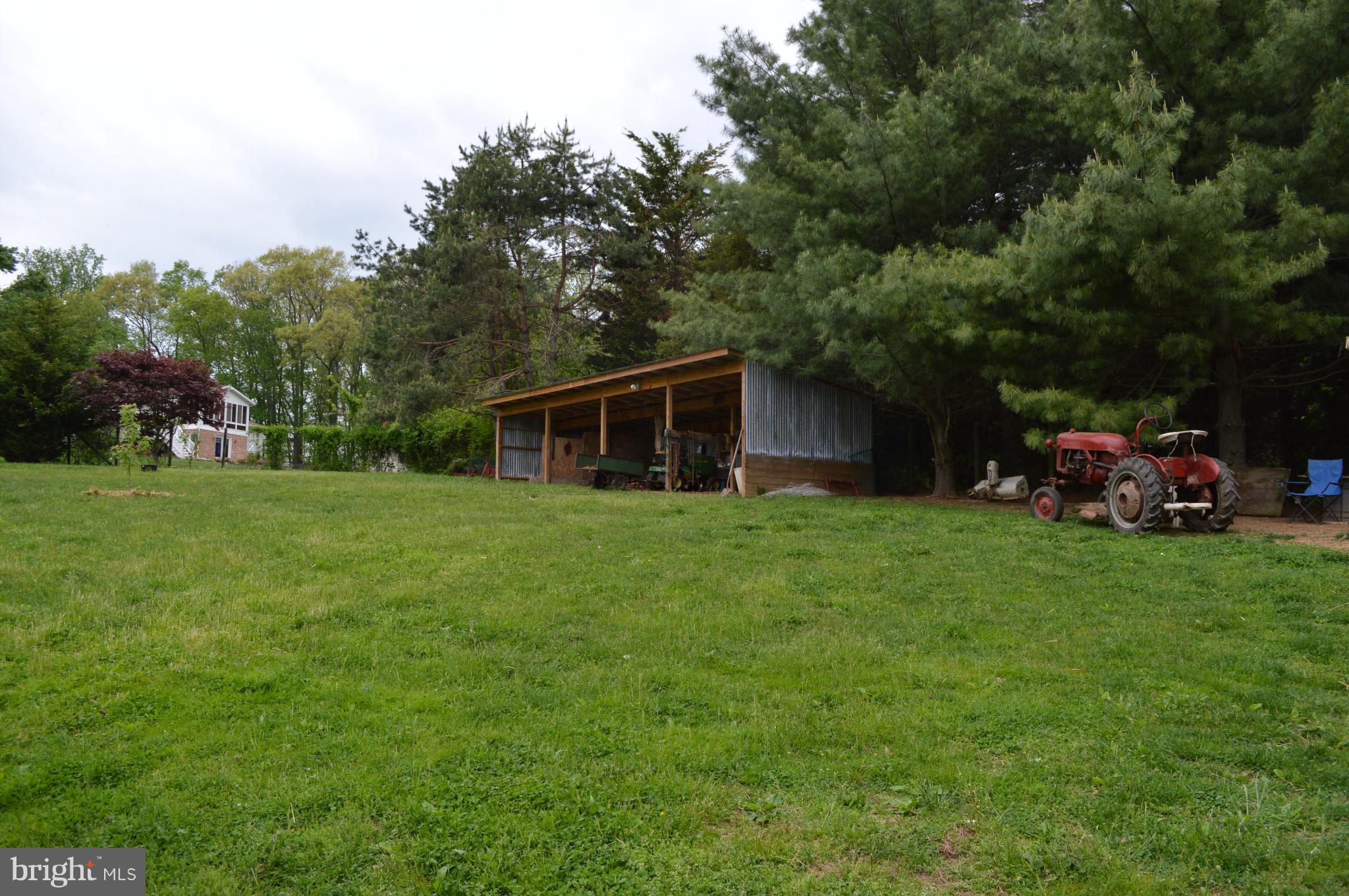 60 East Nicodemus Road Westminster, MD 21157 - Photo 18 of 21 a front view of a house with a garden