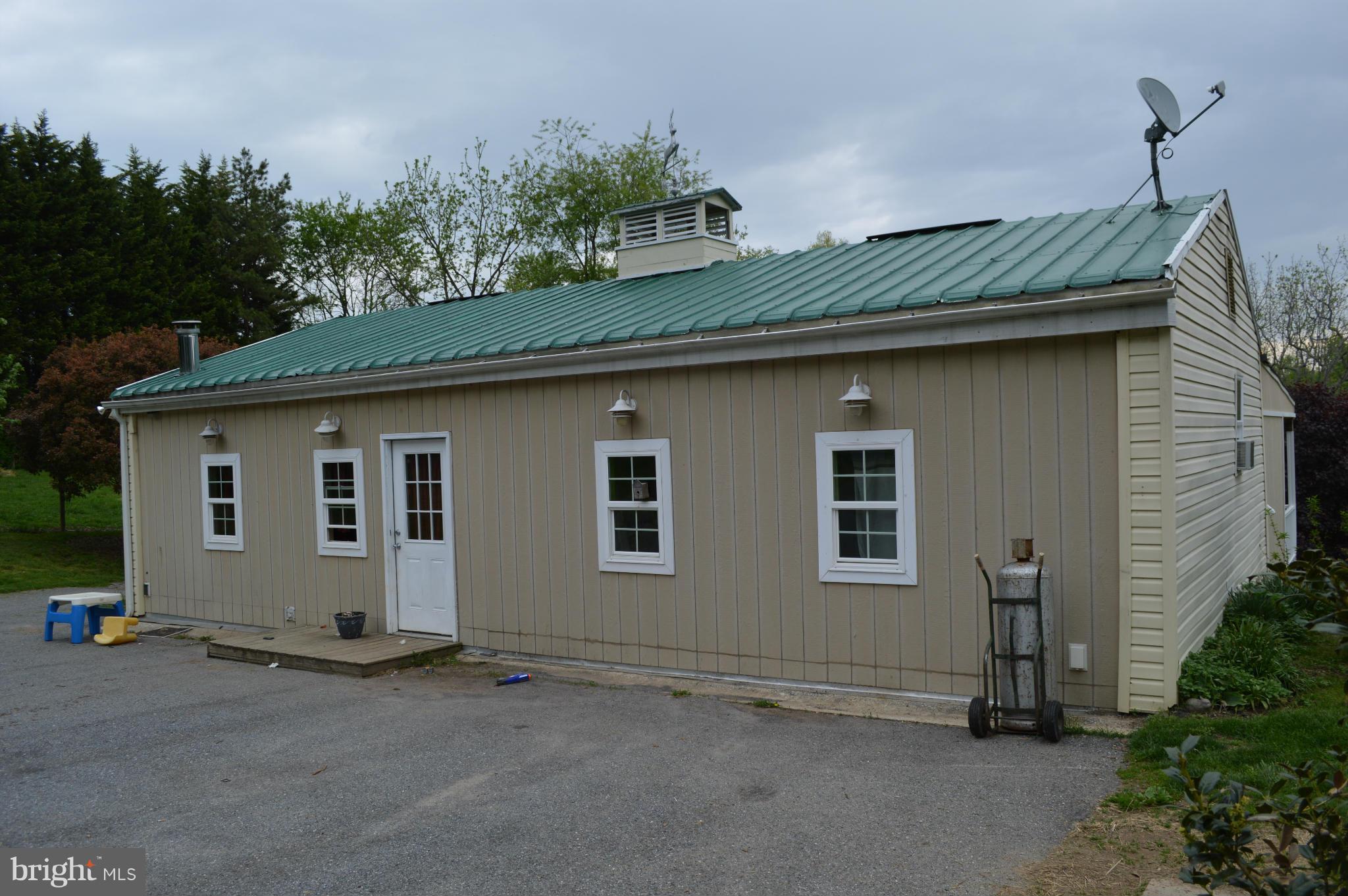 60 East Nicodemus Road Westminster, MD 21157 - Photo 3 of 21 a front view of a house with a garden
