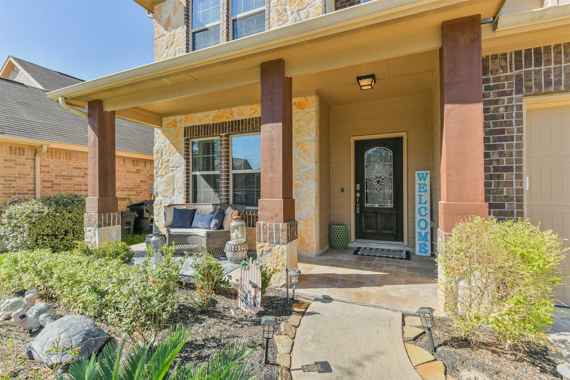 24047 Schults Meadow Lane Spring, TX 77389 - Photo 2 of 47 a front view of a house with garden