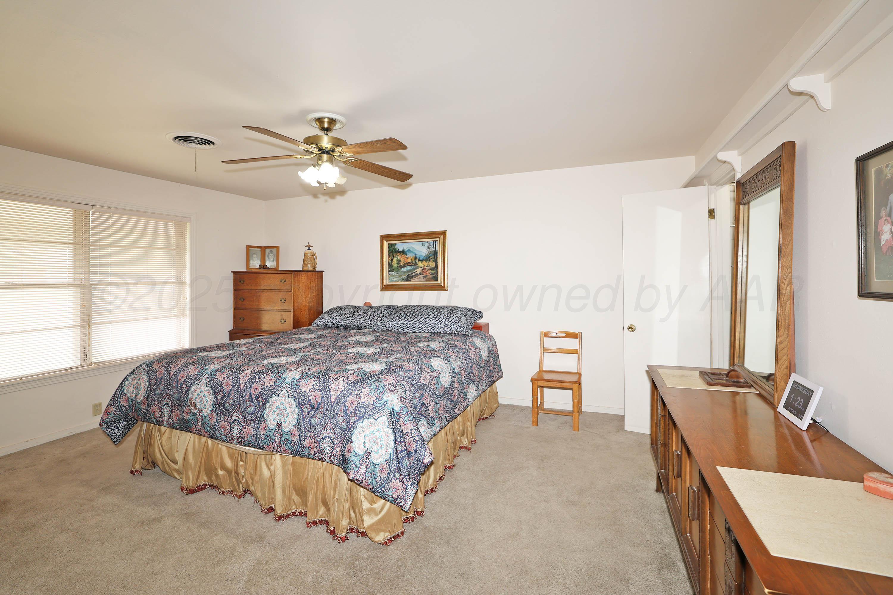 2816 Lloyd Drive Amarillo, TX 79110 - Photo 15 of 29 a spacious bedroom with a bed and dresser