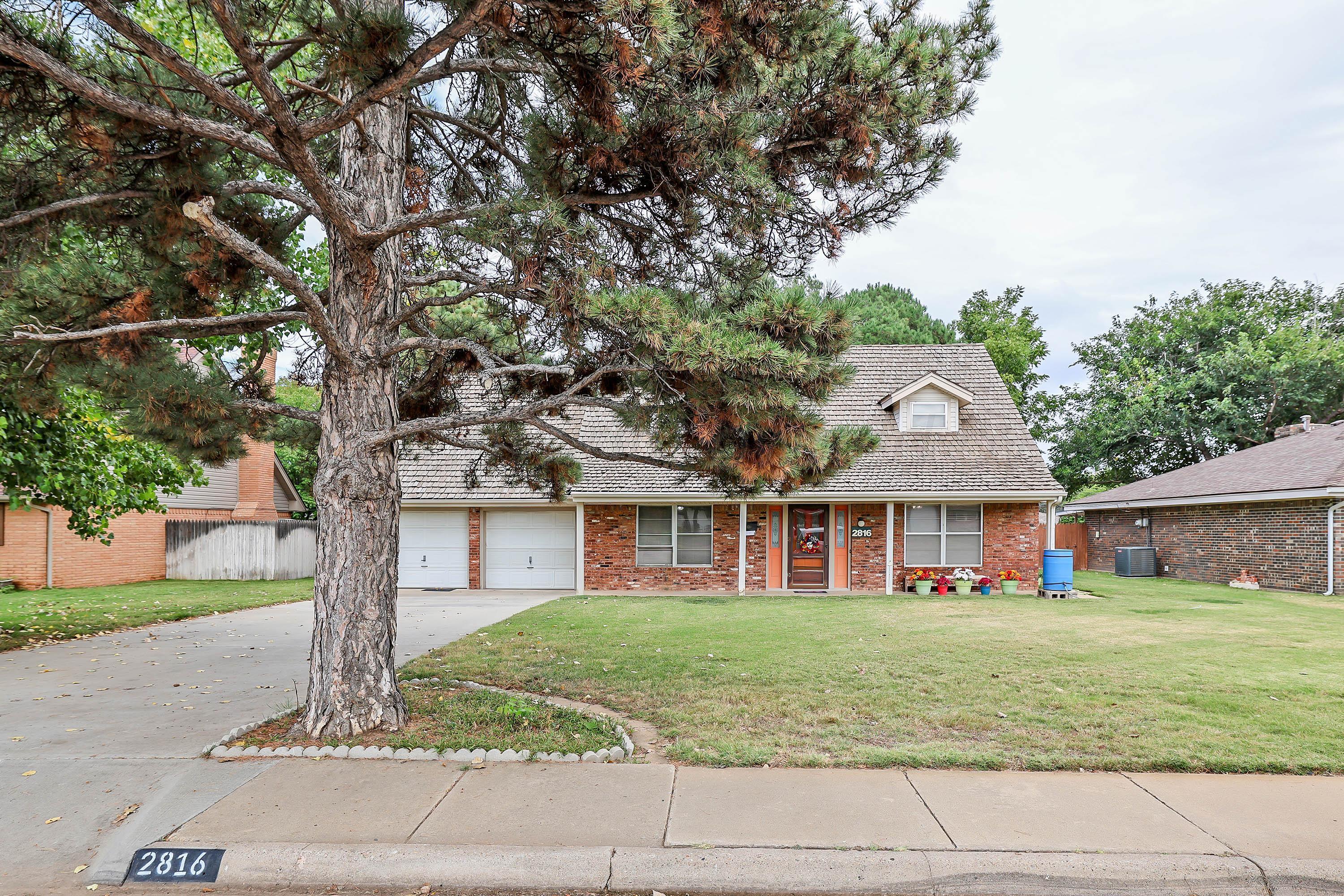 2816 Lloyd Drive Amarillo, TX 79110 - Photo 2 of 29 a front view of a house with garden