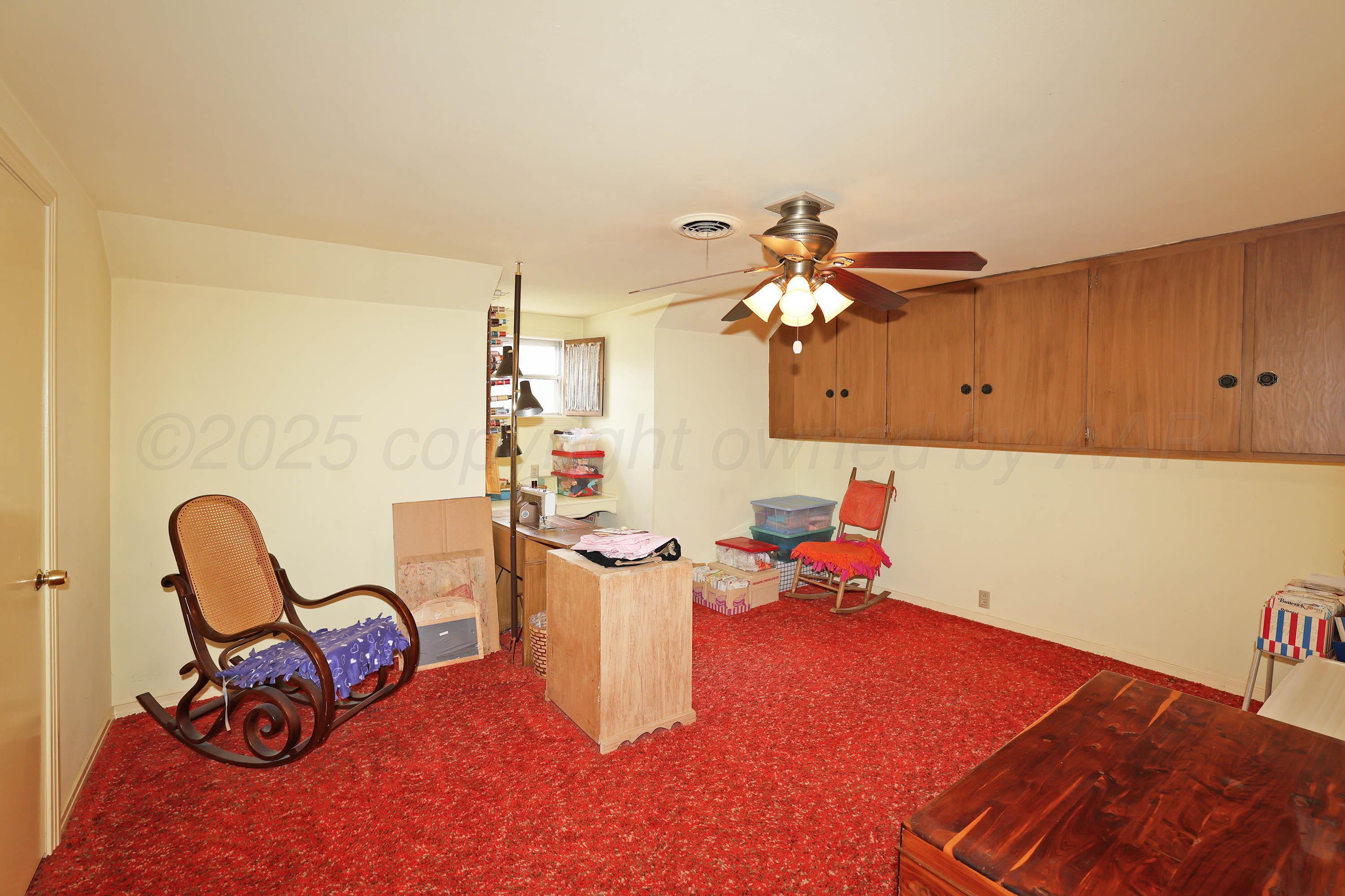 2816 Lloyd Drive Amarillo, TX 79110 - Photo 22 of 29 a dining room with furniture and a chandelier