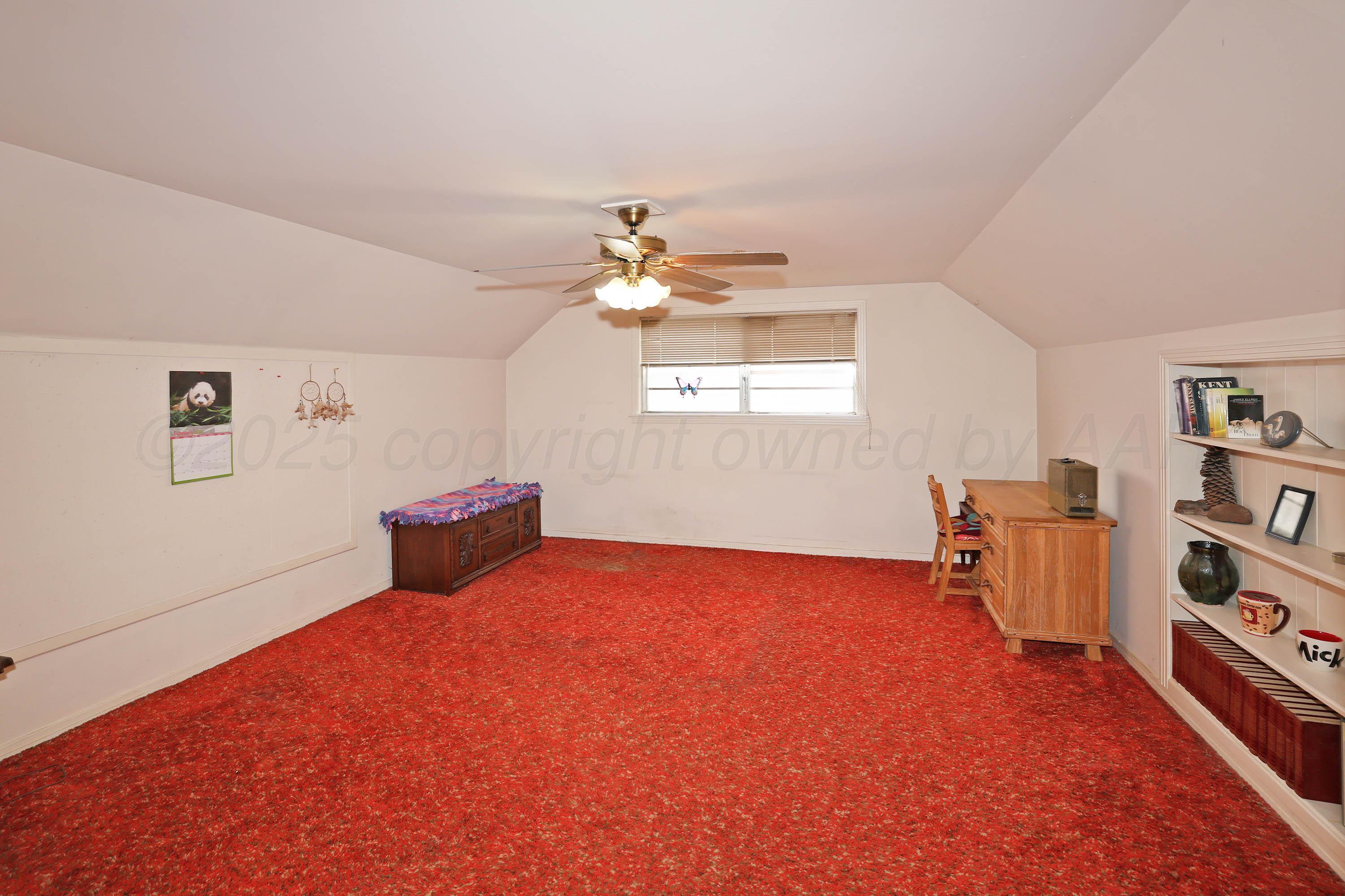 2816 Lloyd Drive Amarillo, TX 79110 - Photo 24 of 29 wooden floor in an empty room with a window