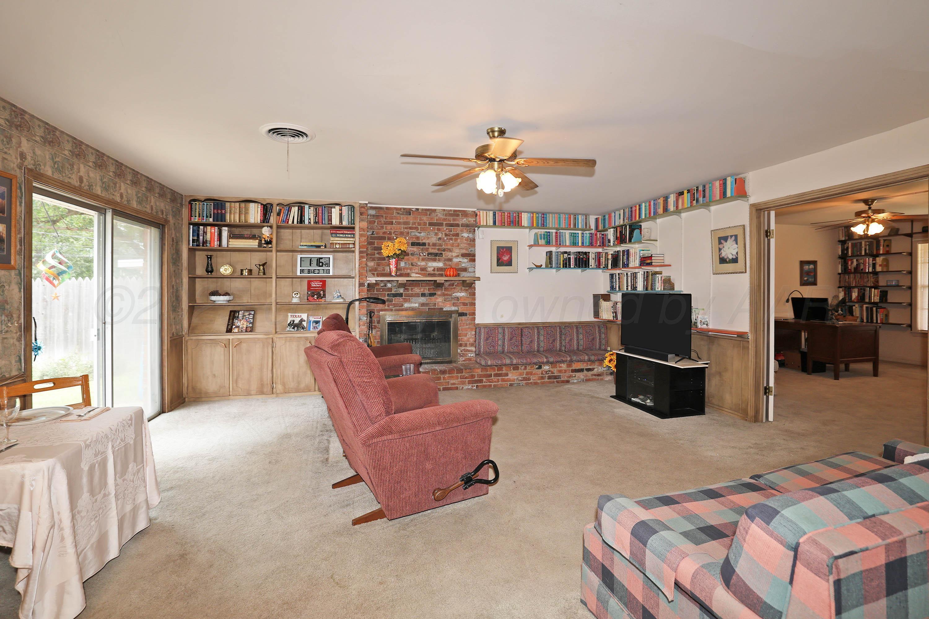 2816 Lloyd Drive Amarillo, TX 79110 - Photo 7 of 29 a living room with furniture and a chandelier