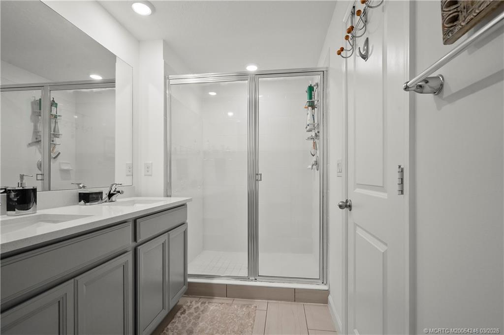 380 Southeast Sea Hunt Way Stuart, FL 34994 - Photo 29 of 42 a bathroom with a double vanity sink mirror and double
