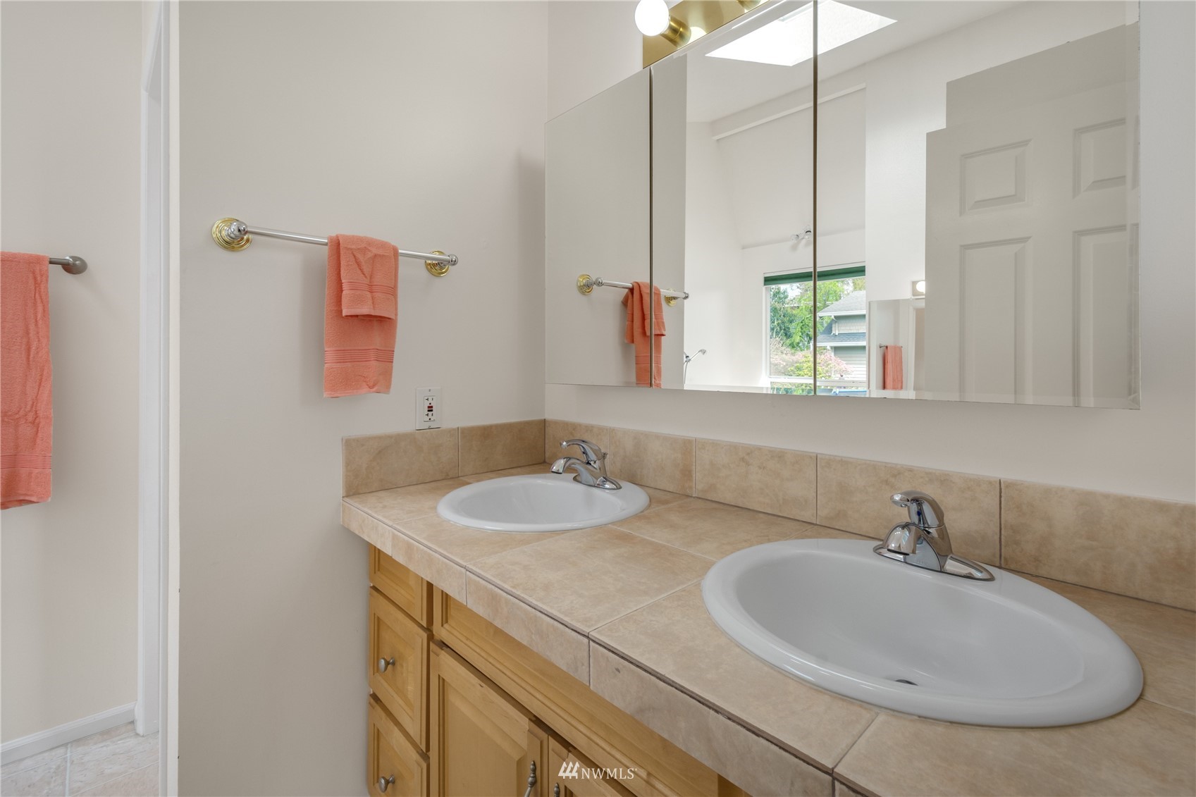 831 Pine Street Edmonds, WA 98020 - Photo 13 of 35 a bathroom with a sink and a mirror