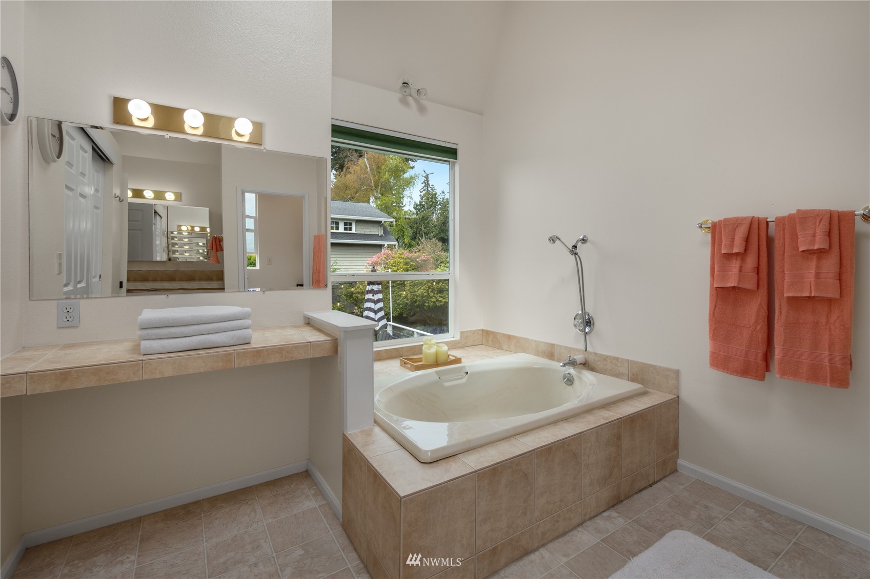 831 Pine Street Edmonds, WA 98020 - Photo 14 of 35 a bathroom with a tub sink and mirror