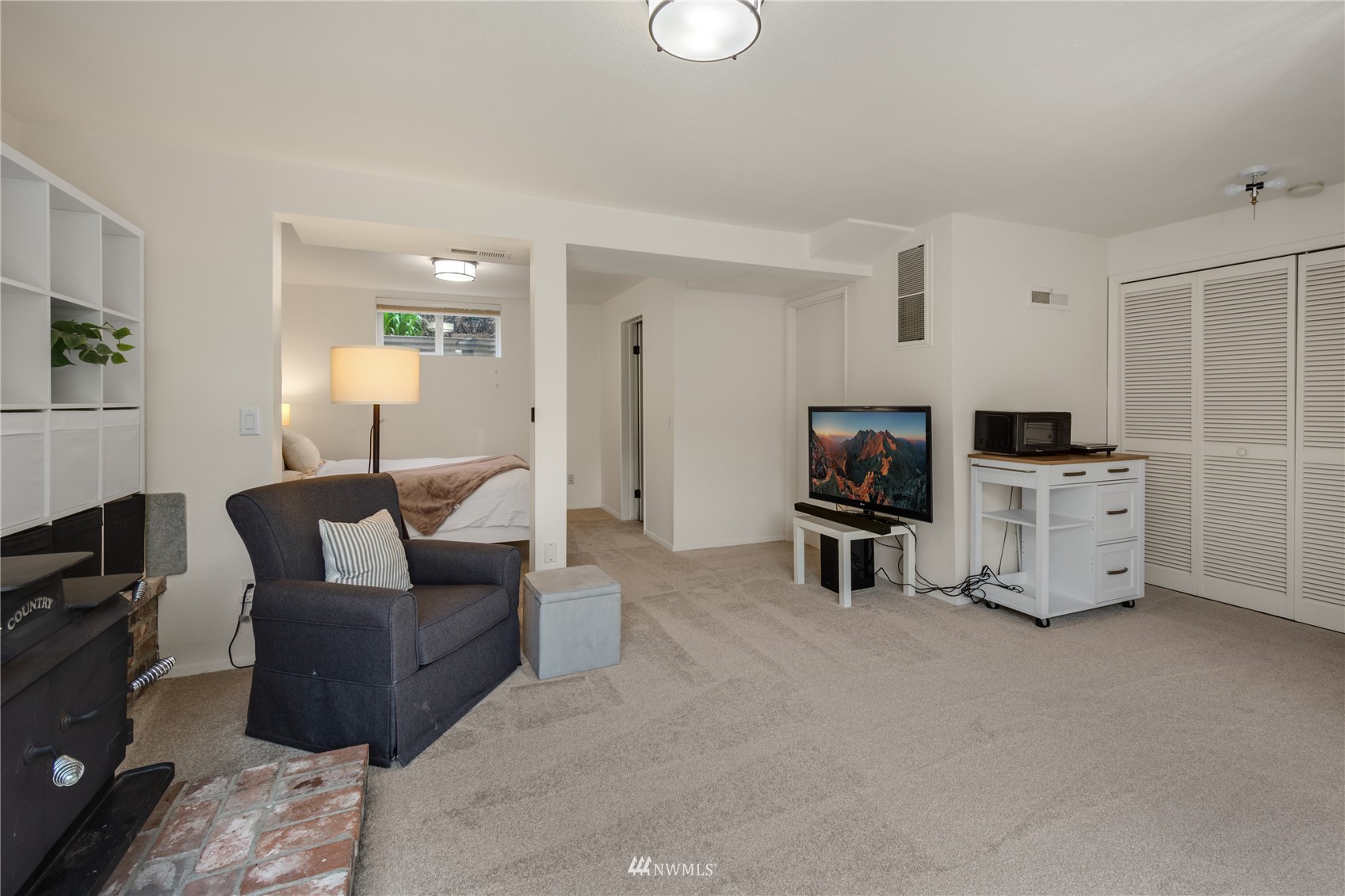 831 Pine Street Edmonds, WA 98020 - Photo 22 of 35 a living room with furniture and a flat screen tv