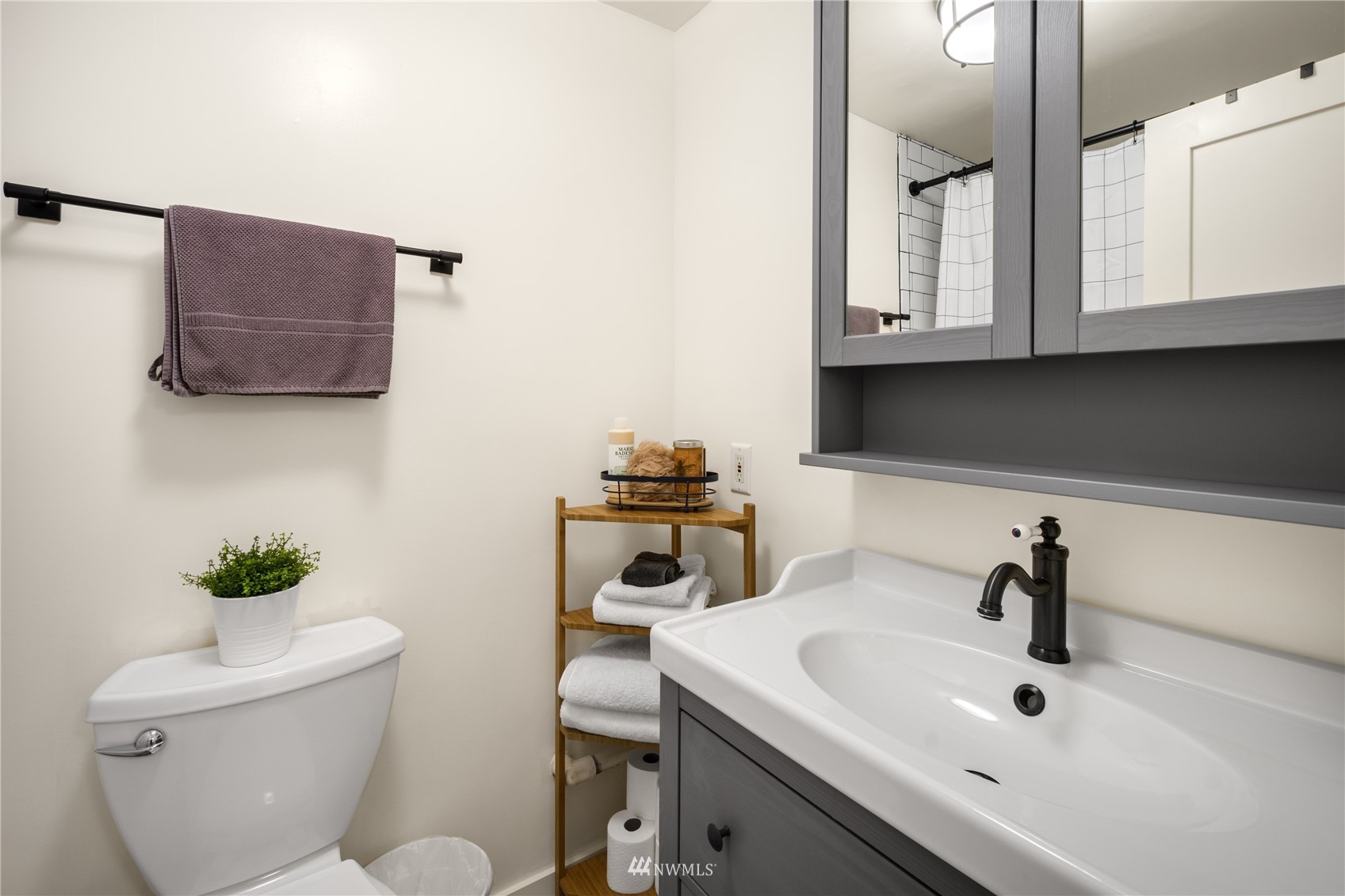 831 Pine Street Edmonds, WA 98020 - Photo 24 of 35 a bathroom with a toilet sink and mirror