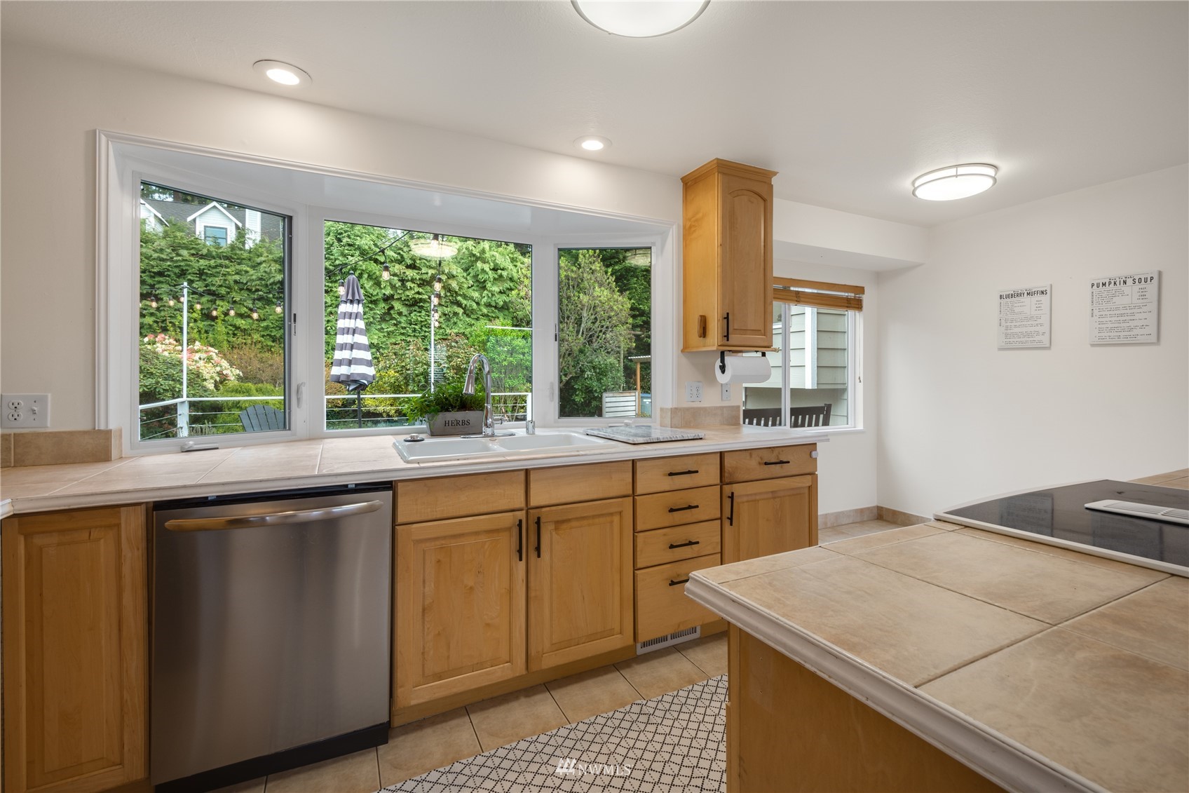 831 Pine Street Edmonds, WA 98020 - Photo 4 of 35 a kitchen with a sink stove and microwave