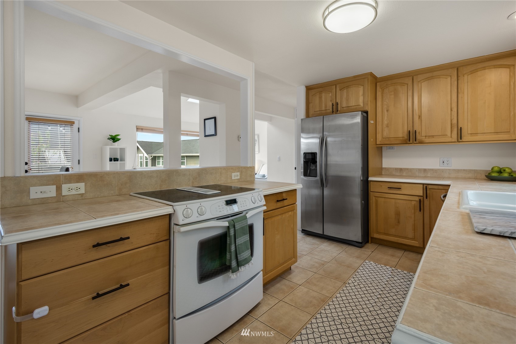 831 Pine Street Edmonds, WA 98020 - Photo 5 of 35 a kitchen with a stove sink and refrigerator