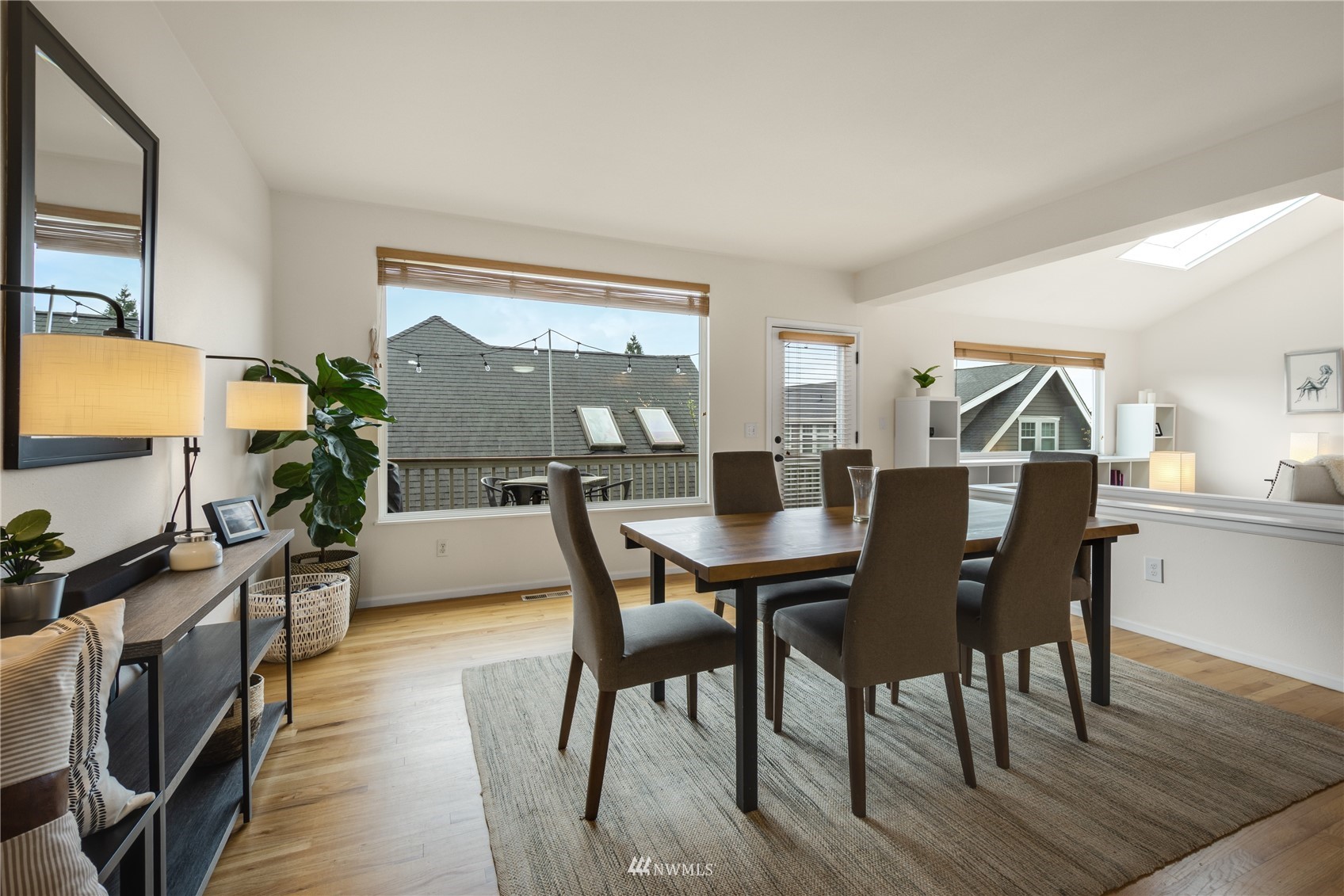 831 Pine Street Edmonds, WA 98020 - Photo 8 of 35 a view of a dining room with furniture and wooden floor